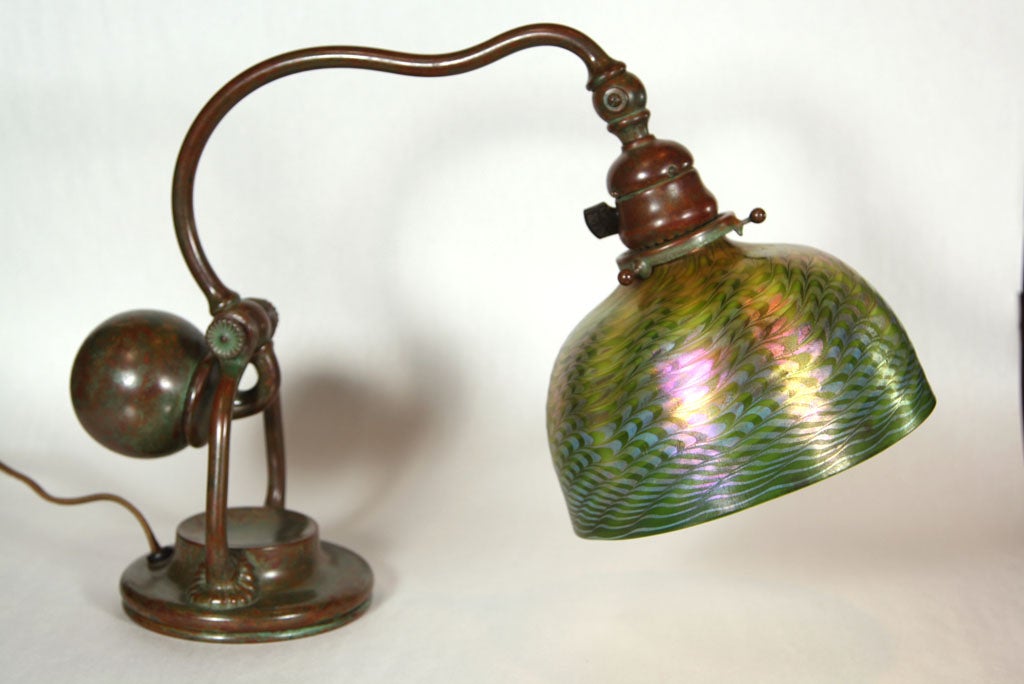 PERFECT Tiffany Studios counterbalance desk lamp with bronze base and Tiffany Studios New York 416  Perfect Patina!<br />
Damascene shade is multi-colored. Shade is perfect with excellent irridescence.